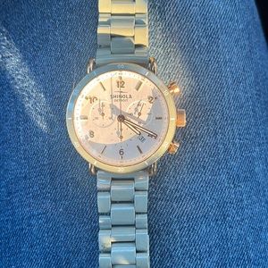 Shinola women’s watch. Rose gold, white face with a grey bracelet